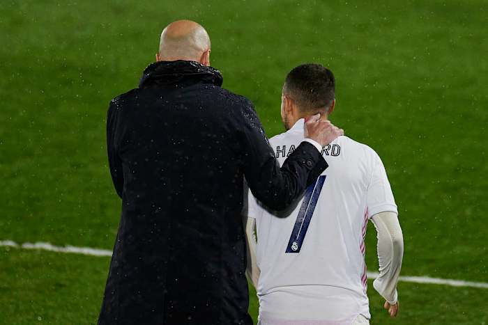 Manager Zinedine Zidane pictured (left) with his arm around Eden Hazard during a UEFA Champions League game between Real Madrid and Chelsea in April 2021